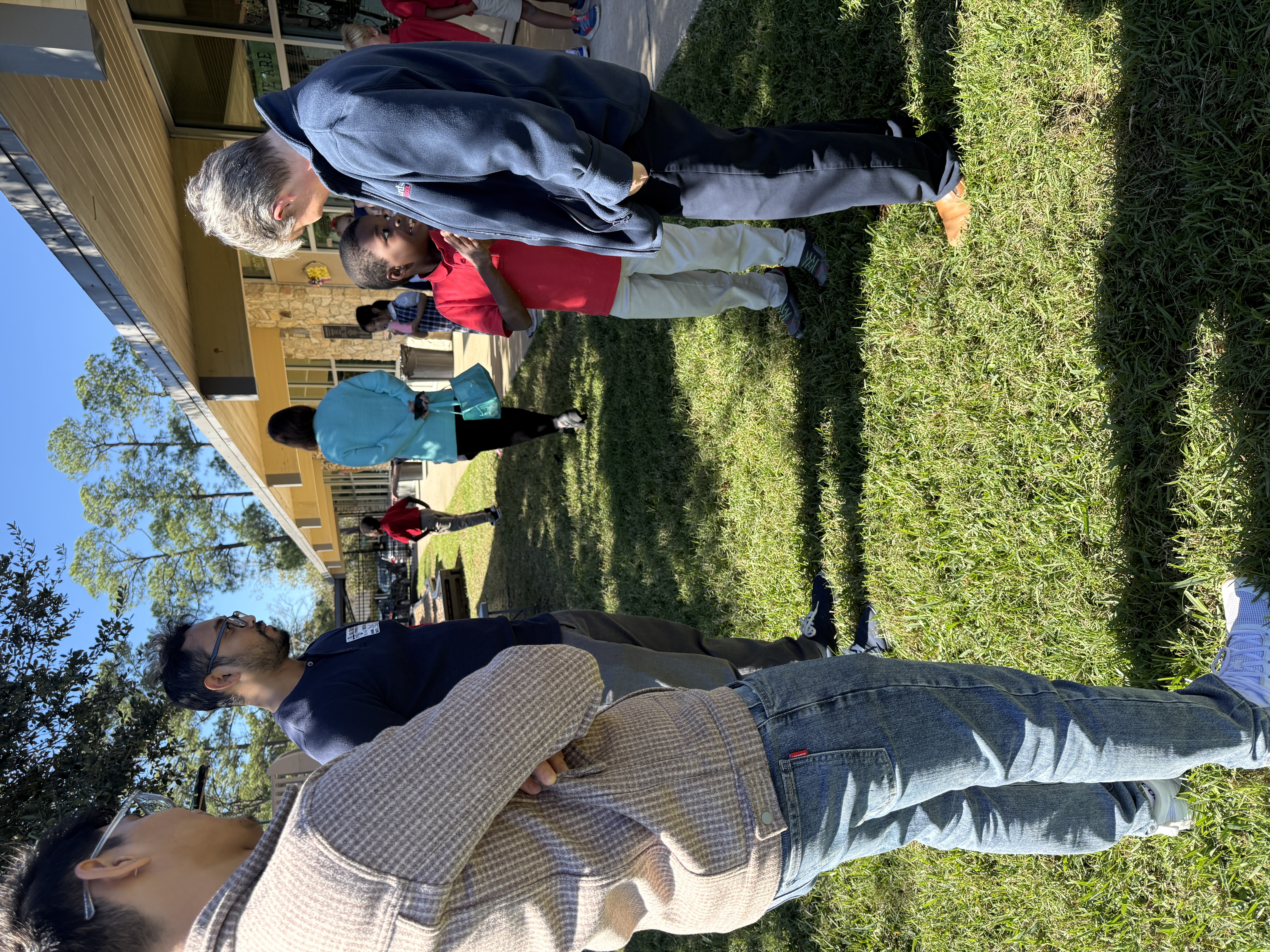 Conversation with students outside in the field